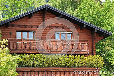 Wooden chalet among summer trees Stock Photo