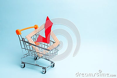 wooden checkmark for voting on elections in a supermarket trolley. Lobbying interests, election corruption voter bribery, Stock Photo