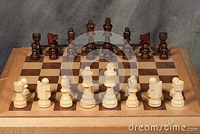 Wooden Chess Set on Chess Board Stock Photo