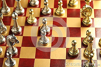 Wooden chessboard with different beautiful game pieces Stock Photo