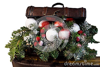 Wooden chest with Christmas gifts. Christmas treasure chest with a Christmas branch. Vintage chest over fir-tree branches Stock Photo