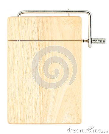 Wooden chopping board with cheese cutter Stock Photo