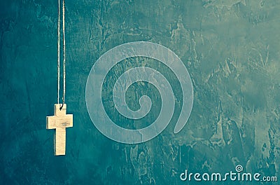 Cross on royal green wall background Stock Photo