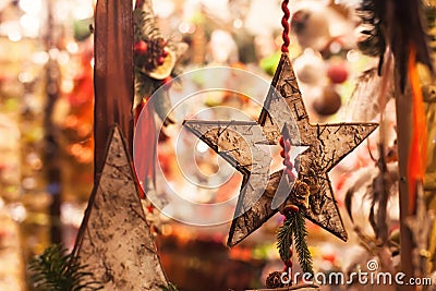 Wooden christmas star decoration close up by night Stock Photo