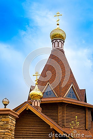 Wooden Church with Golden domes, Orthodox Church Stock Photo