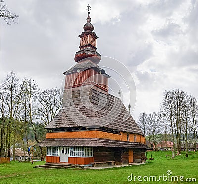 Old wooden church with bell tower in village Pylypets, Ukraine Stock Photo