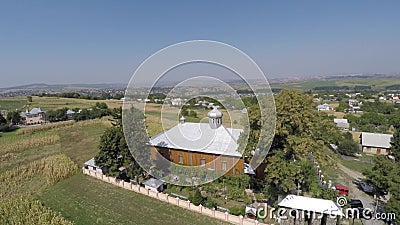 Wooden Church in the village. shooting drone. Stock Photo
