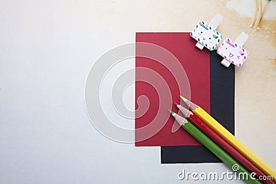 Wooden clips, sticky notes and color pencils Stock Photo