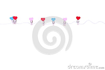 Wooden clothes pins in heart shape patterns hanging on white string isolated on white background , clipping path pink red blue Stock Photo