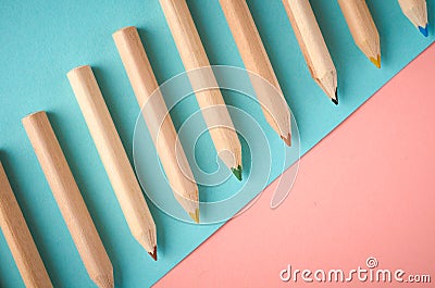 Wooden color pencils on blue background, flat lay Stock Photo