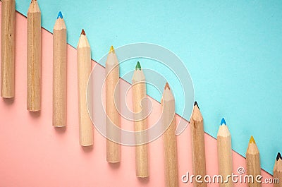 Wooden color pencils on blue background, flat lay Stock Photo