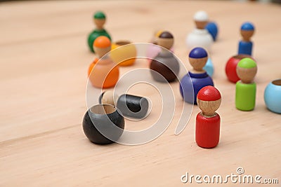 Wooden colorful dolls shaped building blocks on table, closeup. Montessori toy Stock Photo