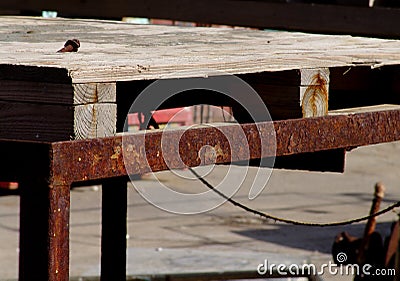 Wooden construction structurein an industrial site, outside, with rusty metal Stock Photo