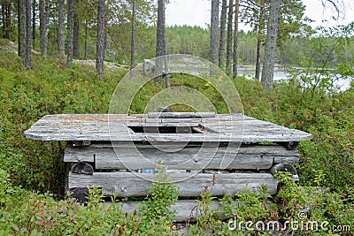 Wooden container from logs for collecting garbage in the wood Stock Photo