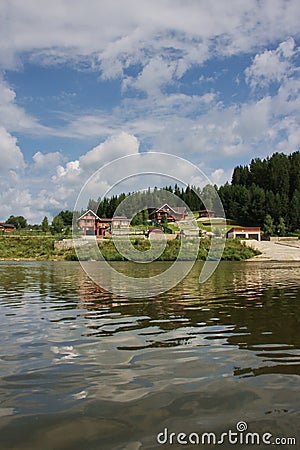 Wooden cottages on the river Chusovaya Stock Photo
