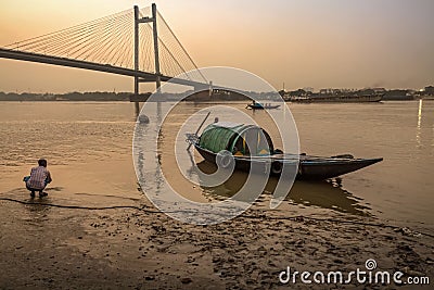 Wooden country boat at Princep Ghat on river Hooghly at dusk. Editorial Stock Photo