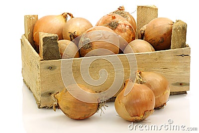 A wooden crate with brown onions Stock Photo