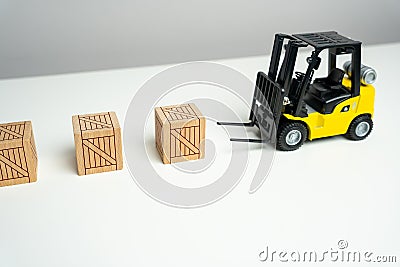 Wooden crates are picked up by a forklift. Preparation of order for shipment. Efficient process of preparing orders for shipment. Stock Photo