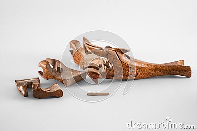 Wooden creative dolphin puzzle toy on white Stock Photo