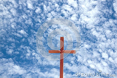 Wooden Cross Against Blue Cloudy Sky Background Stock Photo