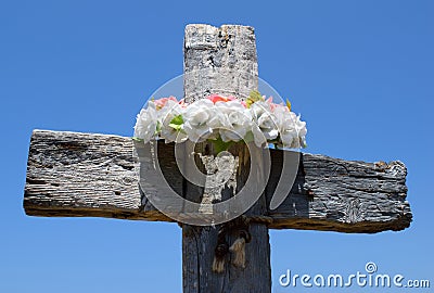Wooden cross with wreath Stock Photo
