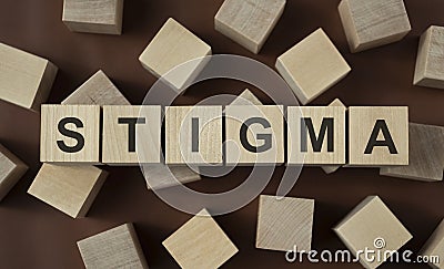 Wooden Cube against a dark background Stock Photo