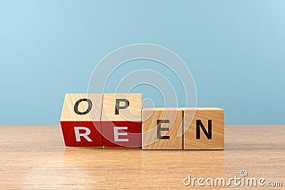 Wooden cube block flip over word REEN to OPEN on wood table, 3D render Stock Photo