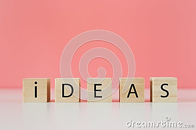 wooden cube blocks with word ideas, thinking creative genius innovation knowledge successful. Stock Photo