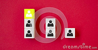 Wooden cube with person icon stand out from the crowd on red background. Dissenting opinion, divergent views and different Stock Photo