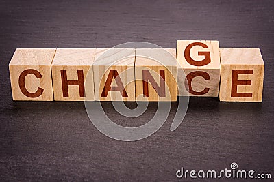 Wooden Cubes As A Career, And Financial Concept Or Personal Development - Change To Chance Stock Photo