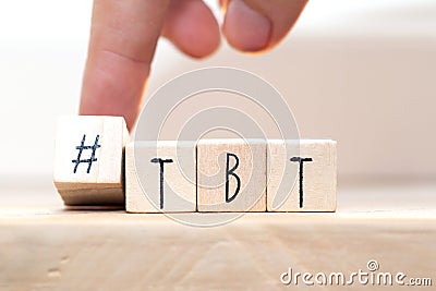Wooden cubes with Hashtag tbt, meaning Throwback Thursday near white background social media concept Stock Photo