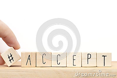 Wooden cubes with a hashtag and the word Accept, social media concept near white background Stock Photo