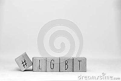 Wooden cubes with a Hashtag and the word LGBT isolated on white, lesbien,gay,bisexual,transgender and social media Stock Photo