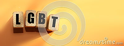 Wooden cubes with letters LGBT on orange, lesbian, gay, bisexual, transgender and social media concept background Stock Photo