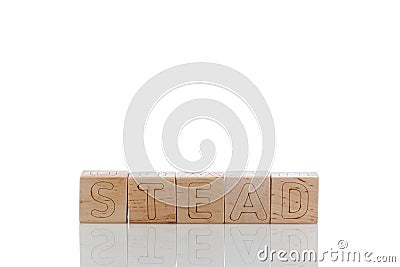 Wooden cubes with letters stead on a white background Stock Photo