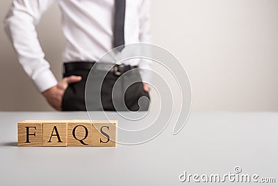 Wooden cubes spelling FAQS Stock Photo