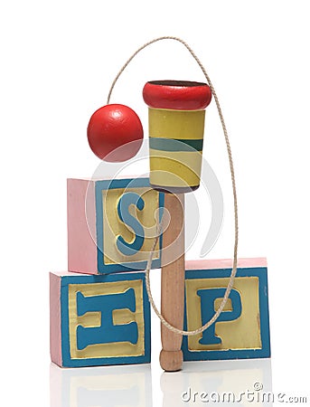 Wooden Cup-and-ball ball in cup toy. Stock Photo