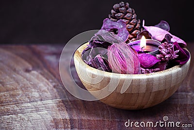 Wooden cup of dryed flowers Stock Photo