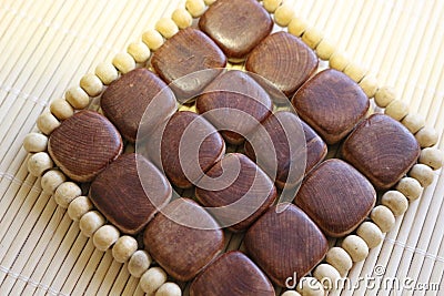 Wooden cup stand made of juniper wood and wooden beads Stock Photo