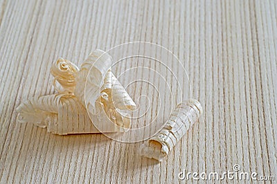 Wood shavings lying on a wooden Board. Background. Do-it-yourself concept. Stock Photo