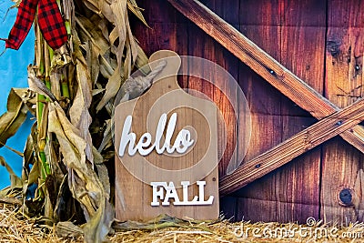 Wooden cutting board with `Hello Fall` text on it Stock Photo