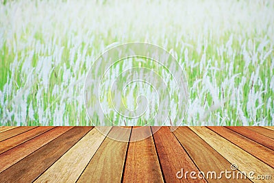 Wooden deck table over beautiful blurred grassland Stock Photo