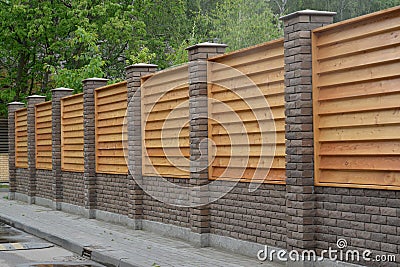 Wooden decorative fence around a garden Stock Photo