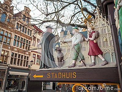 Wooden decorative road sign to the city hall of Mechelen in traditional medieval design next to the main square, Mechelen, Belgium Editorial Stock Photo