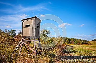 Wooden deer hunting pulpit in autumn Stock Photo