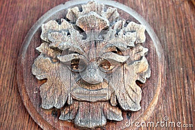 Wooden design element on the front door, late 19th century. Mythological creature.Faun. Stock Photo