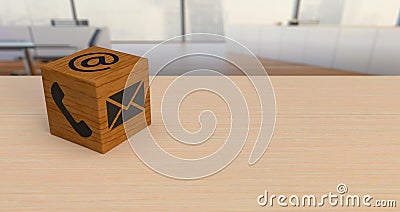 Wooden dice with contact symbols on office desk Stock Photo