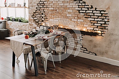 Wooden Dinner Table with Plate and Metallic Chairs Stock Photo