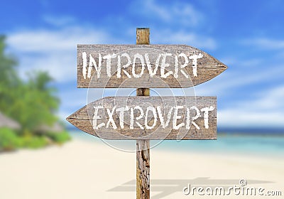 Wooden direction sign with introvert and extrovert Stock Photo
