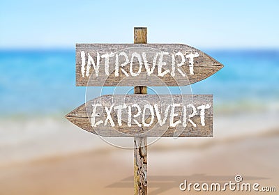Wooden direction sign with introvert and extrovert Stock Photo
